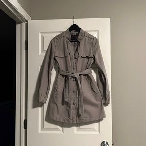 Grey trench coat with unique details